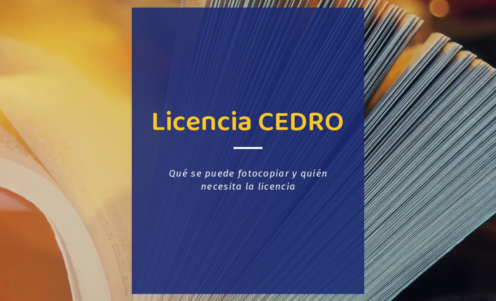 Licencia CEDRO: las páginas de un libro abierto se abren en abanico sobre una mesa